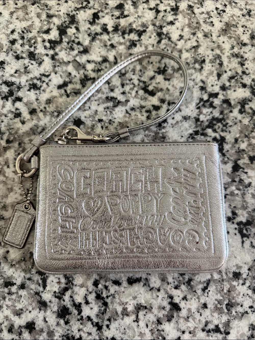 Coach Metallic Silver Poppy Embossed Wristlet